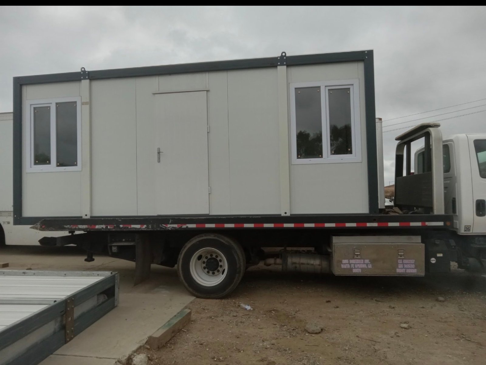EROUnits mobile office transported on a flatbed truck